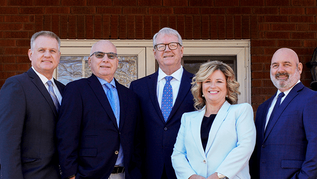 West Virginia Business and Personal Injury Lawyers from Shaffer & Shaffer standing side by side: Todd Mount, Tony Cicconi, Chip Shaffer, Sabrena Gillis and Rich Walters.