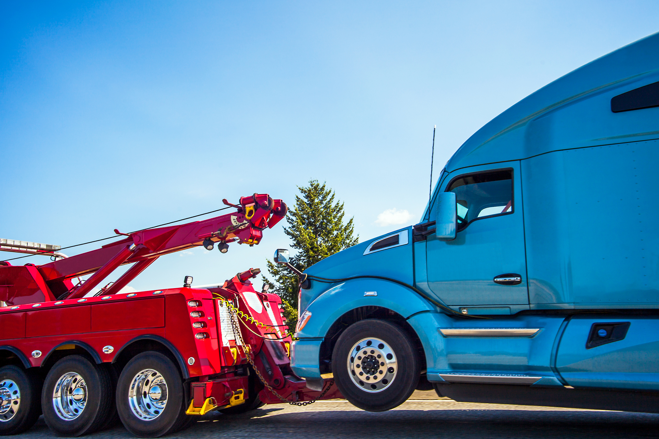 A big rig truck being towed.