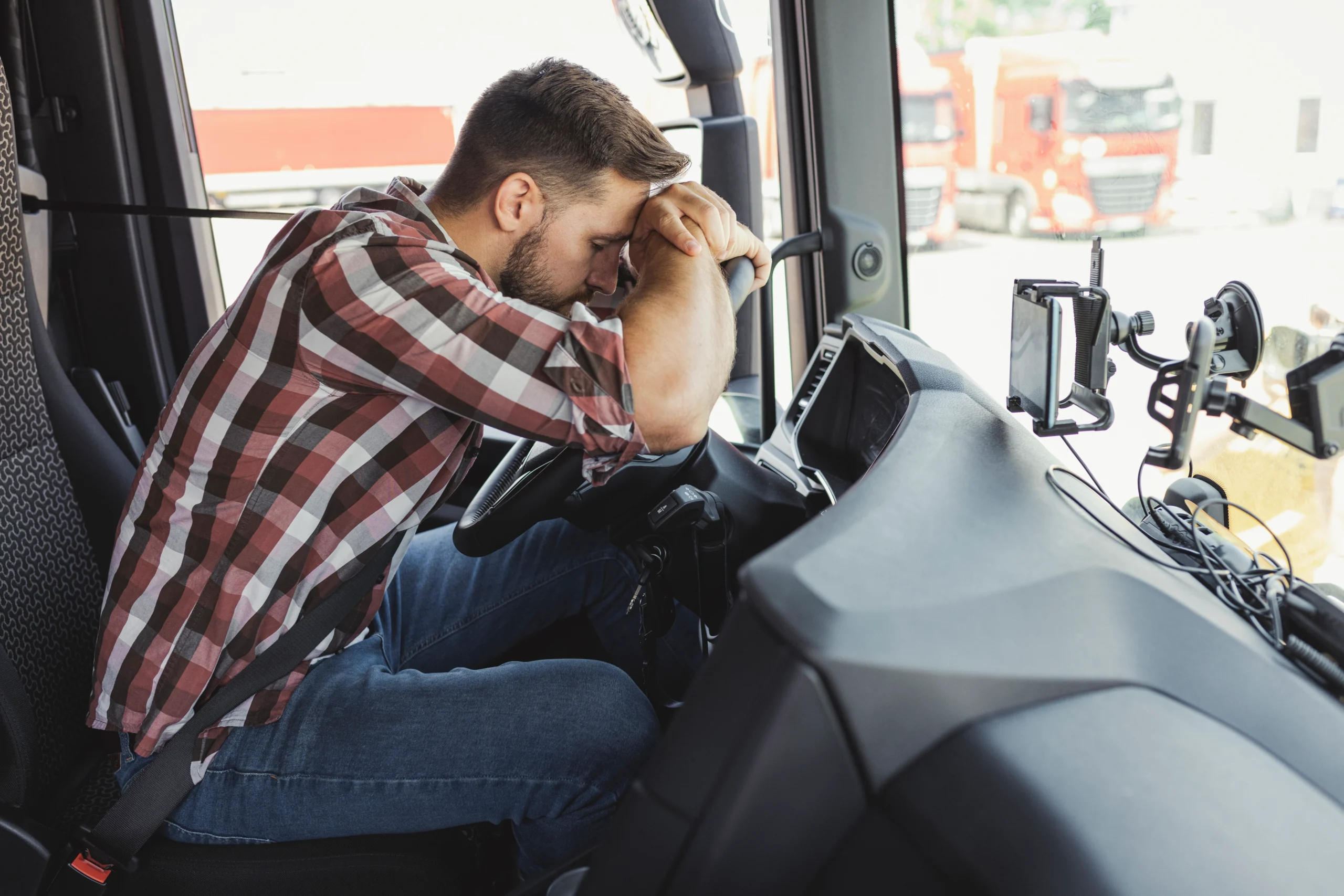 A truck driver frustrated from an accident.